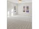 Spacious bedroom with new carpet, ceiling fan and large windows at 5615 Forkwood Nw Dr, Acworth, GA 30101