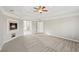 Bright bedroom featuring a fireplace and carpet flooring at 5615 Forkwood Nw Dr, Acworth, GA 30101