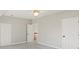 Spacious bedroom with double doors and grey carpet at 5615 Forkwood Nw Dr, Acworth, GA 30101