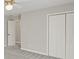 Bright bedroom featuring a ceiling fan and spacious closet at 5615 Forkwood Nw Dr, Acworth, GA 30101