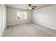 Well-lit bedroom with carpet flooring and ceiling fan at 5615 Forkwood Nw Dr, Acworth, GA 30101