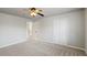 Spacious bedroom with ceiling fan and double door closet at 5615 Forkwood Nw Dr, Acworth, GA 30101