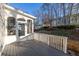 Deck with white railing overlooking a wooded backyard at 5615 Forkwood Nw Dr, Acworth, GA 30101