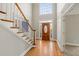 Grand entryway with hardwood floors and a wooden staircase at 5615 Forkwood Nw Dr, Acworth, GA 30101