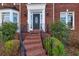 Brick steps leading to a black front door at 5615 Forkwood Nw Dr, Acworth, GA 30101