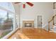 Sunlit Gathering room features a stone fireplace and hardwood floors at 5615 Forkwood Nw Dr, Acworth, GA 30101