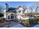 White two story house with a large screened porch at 5615 Forkwood Nw Dr, Acworth, GA 30101