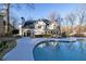 Two-story house with a large in-ground pool and screened porch at 5615 Forkwood Nw Dr, Acworth, GA 30101