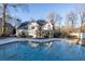 Two-story house with a large in-ground pool and screened porch at 5615 Forkwood Nw Dr, Acworth, GA 30101