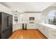 Updated kitchen with white cabinets and hardwood floors at 5615 Forkwood Nw Dr, Acworth, GA 30101