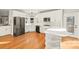 Modern kitchen with white cabinets and island at 5615 Forkwood Nw Dr, Acworth, GA 30101