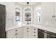Kitchen corner with white cabinets and arched windows at 5615 Forkwood Nw Dr, Acworth, GA 30101