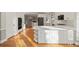 Spacious kitchen with white cabinets and a large island at 5615 Forkwood Nw Dr, Acworth, GA 30101