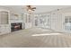 Spacious living room with fireplace and large windows at 5615 Forkwood Nw Dr, Acworth, GA 30101