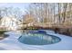 Inviting kidney-shaped pool surrounded by a large deck at 5615 Forkwood Nw Dr, Acworth, GA 30101