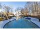 Large kidney-shaped swimming pool with surrounding landscaping at 5615 Forkwood Nw Dr, Acworth, GA 30101