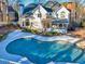 Freeform swimming pool with flagstone patio and hot tub at 5615 Forkwood Nw Dr, Acworth, GA 30101