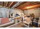 Unfinished basement with various furniture and storage items at 605 Rose Creek Cir, Duluth, GA 30097