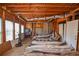 Unfinished basement area with exposed beams and storage at 605 Rose Creek Cir, Duluth, GA 30097