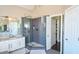 Elegant bathroom with a large walk-in shower and granite countertop at 605 Rose Creek Cir, Duluth, GA 30097
