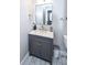 Small bathroom with gray vanity, marble countertop, and modern mirror at 605 Rose Creek Cir, Duluth, GA 30097