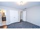 Spacious bedroom with dark hardwood floors and en-suite bathroom at 605 Rose Creek Cir, Duluth, GA 30097