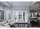 Bright breakfast nook with large windows and seating area at 605 Rose Creek Cir, Duluth, GA 30097