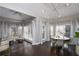 Spacious breakfast nook with a round table and chairs, hardwood floors, and large windows at 605 Rose Creek Cir, Duluth, GA 30097