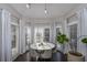 Elegant dining area with a round table and seating for six at 605 Rose Creek Cir, Duluth, GA 30097
