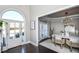 Spacious dining area with a round table, neutral decor, and a modern chandelier at 605 Rose Creek Cir, Duluth, GA 30097