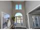 Bright and airy two-story foyer with hardwood floors and high ceilings at 605 Rose Creek Cir, Duluth, GA 30097