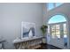 Modern two-story entryway, featuring a console table and large abstract art at 605 Rose Creek Cir, Duluth, GA 30097