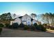 Stunning two-story home nestled on a tree-lined lot, showcasing its charming facade at 605 Rose Creek Cir, Duluth, GA 30097