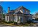 Two-story house with beige exterior, gray roof, and landscaping at 605 Rose Creek Cir, Duluth, GA 30097