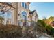Elegant front entrance with stone steps, iron railing, and arched entryway at 605 Rose Creek Cir, Duluth, GA 30097