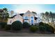 Front view of a two story house with manicured landscaping at 605 Rose Creek Cir, Duluth, GA 30097