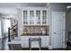Kitchen with built-in desk and glass-front cabinets at 605 Rose Creek Cir, Duluth, GA 30097