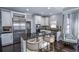 Updated kitchen with stainless steel appliances and granite countertops at 605 Rose Creek Cir, Duluth, GA 30097