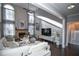 Spacious living room with high ceilings, fireplace, and large windows at 605 Rose Creek Cir, Duluth, GA 30097