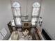 High-ceiling living room with fireplace and hardwood floors at 605 Rose Creek Cir, Duluth, GA 30097