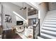 Two-story living room with hardwood floors, staircase, and comfortable seating at 605 Rose Creek Cir, Duluth, GA 30097