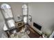 Living room with hardwood floors and a fireplace at 605 Rose Creek Cir, Duluth, GA 30097