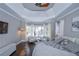 Main bedroom with hardwood floors, bay window, and a cozy sitting area at 605 Rose Creek Cir, Duluth, GA 30097