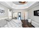 Large main bedroom with high ceilings, coffered ceiling, and hardwood floors at 605 Rose Creek Cir, Duluth, GA 30097