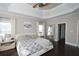 Spacious main bedroom with high ceilings, a large bed, and ample closet space at 605 Rose Creek Cir, Duluth, GA 30097