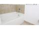 Bathroom featuring a bathtub and tile surround at 870 Mayson Turner Nw Rd # 1210, Atlanta, GA 30314