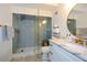 Modern bathroom with a walk-in shower and marble vanity at 1409 Sheridan Ne Rd, Atlanta, GA 30324