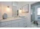 Bathroom with white vanity, marble countertop, and a walk-in shower at 1409 Sheridan Ne Rd, Atlanta, GA 30324