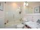 Charming bathroom with a tub, shower, and pink walls at 1409 Sheridan Ne Rd, Atlanta, GA 30324