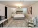 Basement bedroom with a gray upholstered bed and accents at 1409 Sheridan Ne Rd, Atlanta, GA 30324